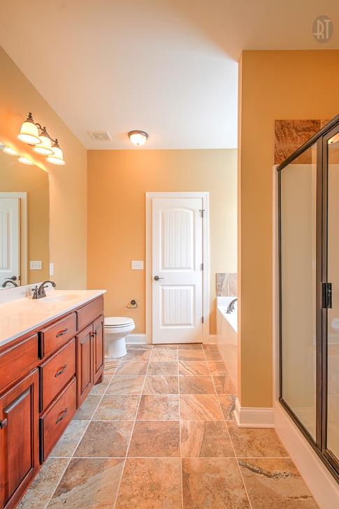 1208 Rimrock Road Smyrna, TN 37167 - Photo 18 of 20 a spacious bathroom with a mirror a bathtub and shower
