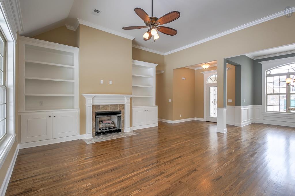 1208 Rimrock Road Smyrna, TN 37167 - Photo 5 of 20 a view of an empty room with a fireplace and a window