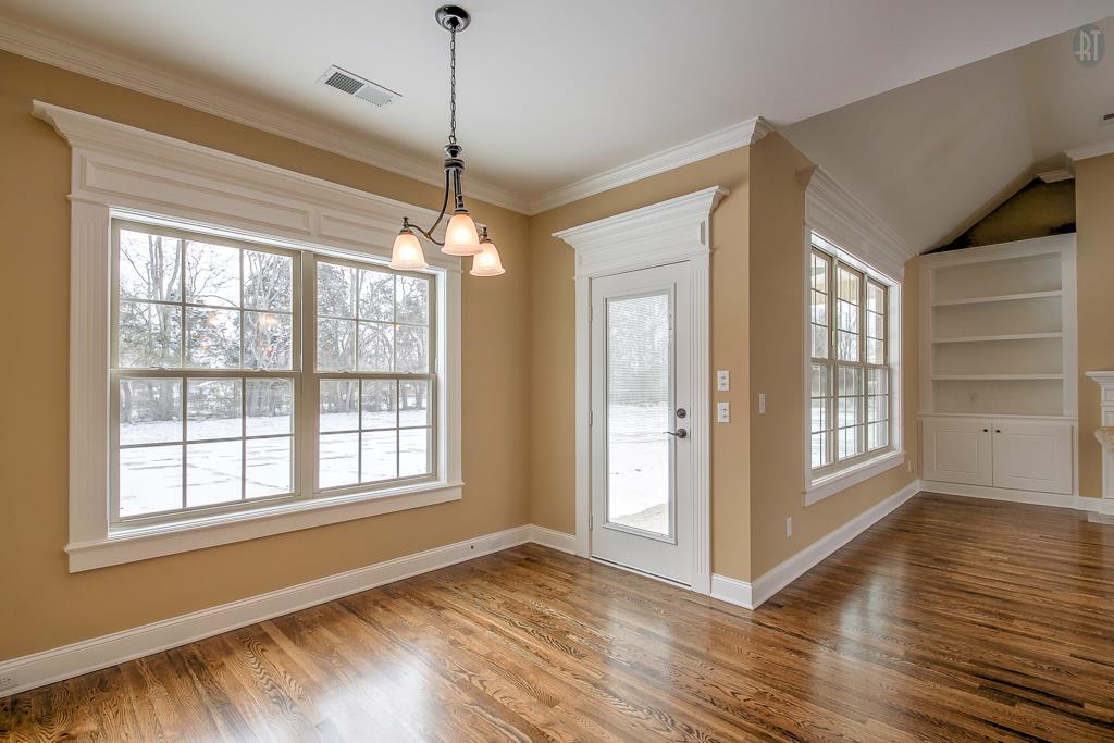 1208 Rimrock Road Smyrna, TN 37167 - Photo 6 of 20 a view of an empty room with wooden floor and a window