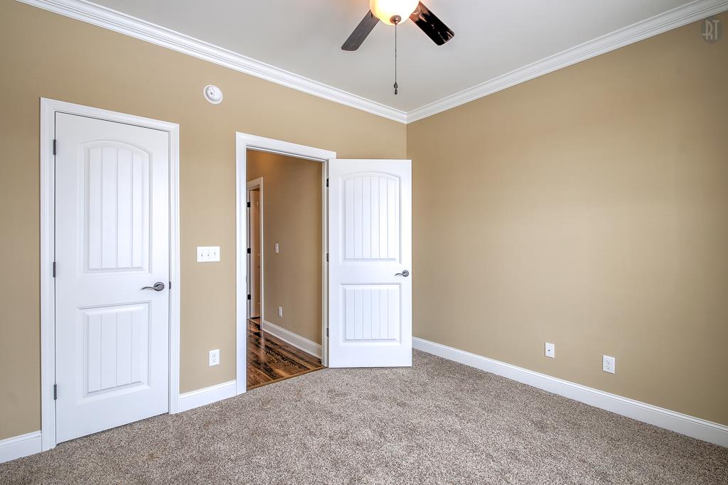 1208 Rimrock Road Smyrna, TN 37167 - Photo 8 of 20 a view of a livingroom with a chandelier fan