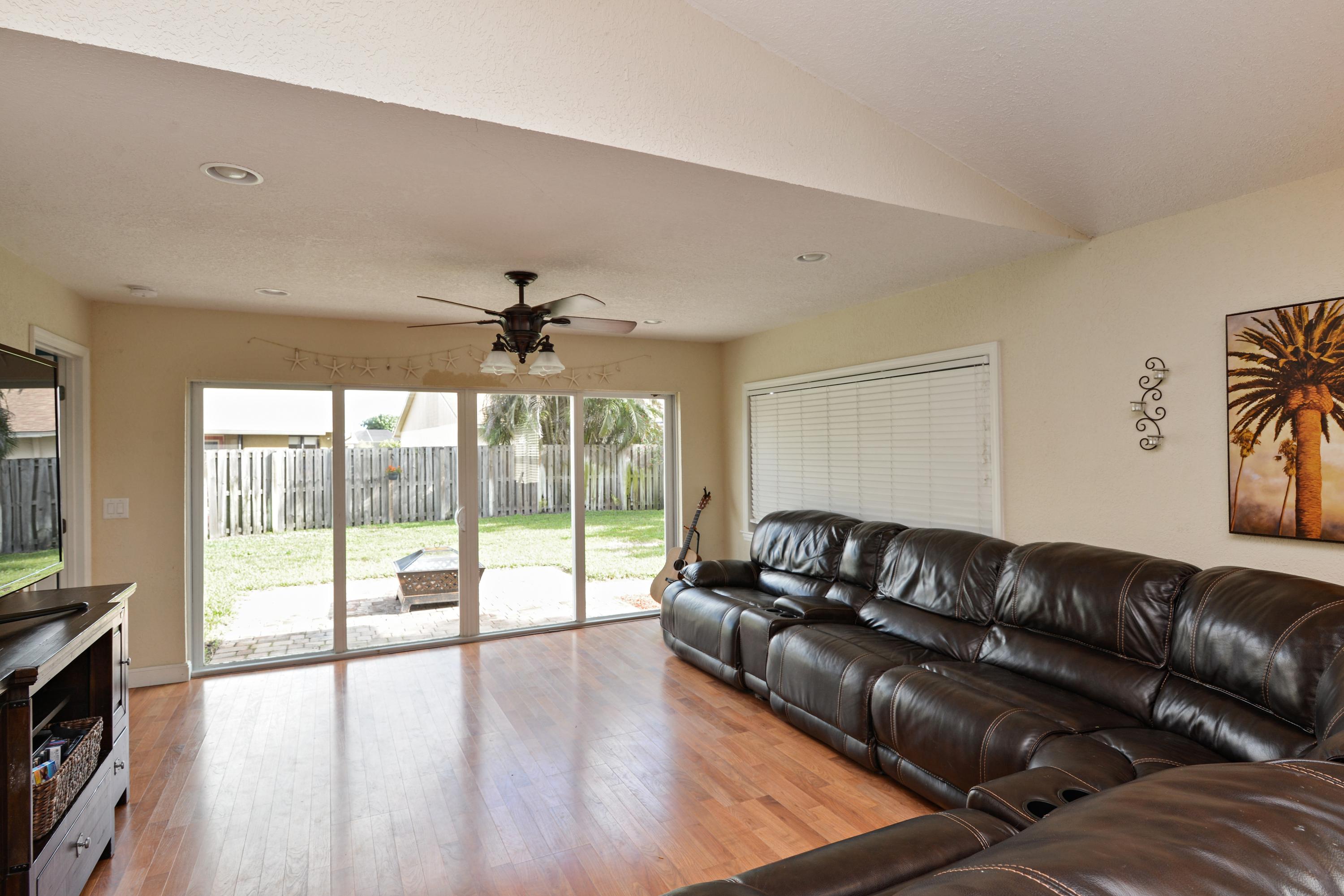 130 Raintree Trail Jupiter, FL 33458 - Photo 7 of 15 02_130RaintreeTrail_1_LivingRoom_HiRes
