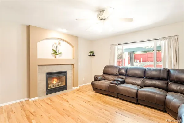 a living room with furniture and a fireplace