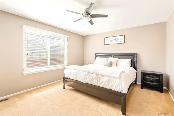 a bedroom with a bed and a tv