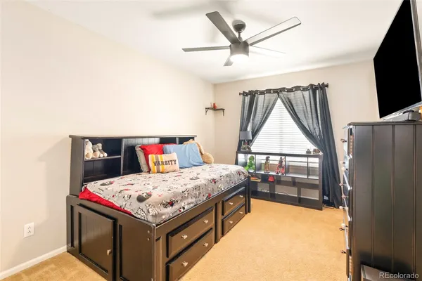 a bed room with a bed and a television
