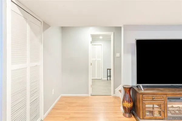 a view of room with window and wooden floor