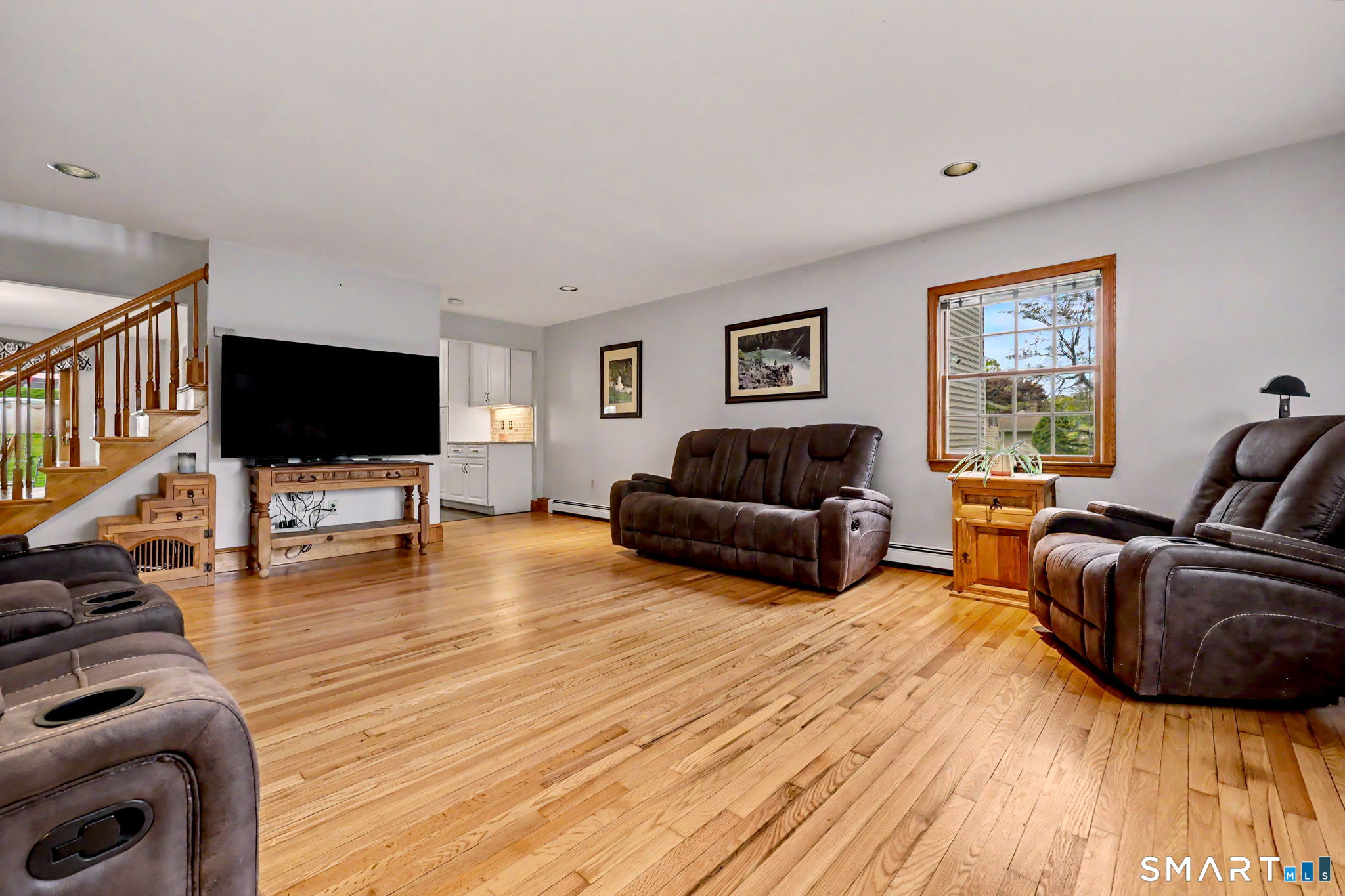 7 Merrill Road Trumbull, CT 06611 - Photo 6 of 40 a living room with furniture and a flat screen tv