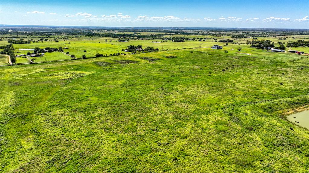 1232 Courtland Tbd County Road Godley, TX 76044 - Photo 6 of 10 a view of a big yard with an ocean