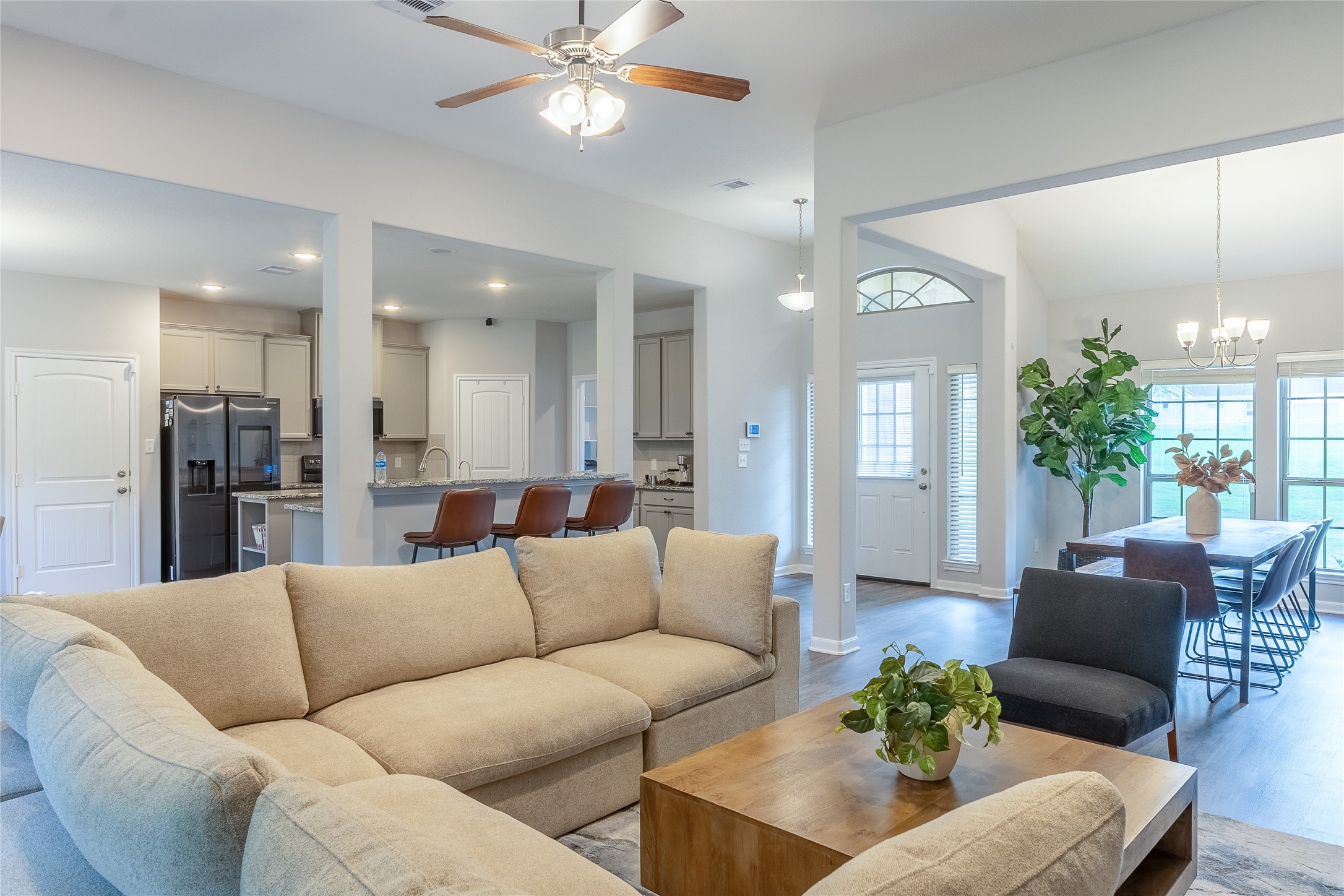 120 Sanctuary Road Huntsville, TX 77340 - Photo 14 of 38 a living room with furniture kitchen and a chandelier