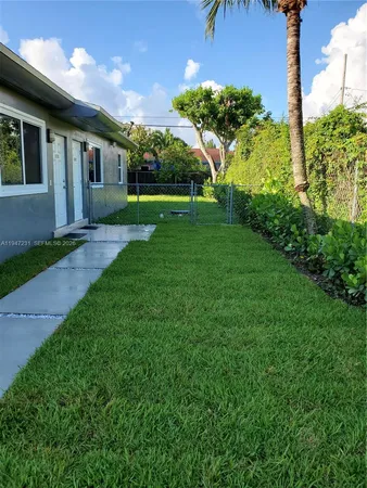 a view of a porch and garden