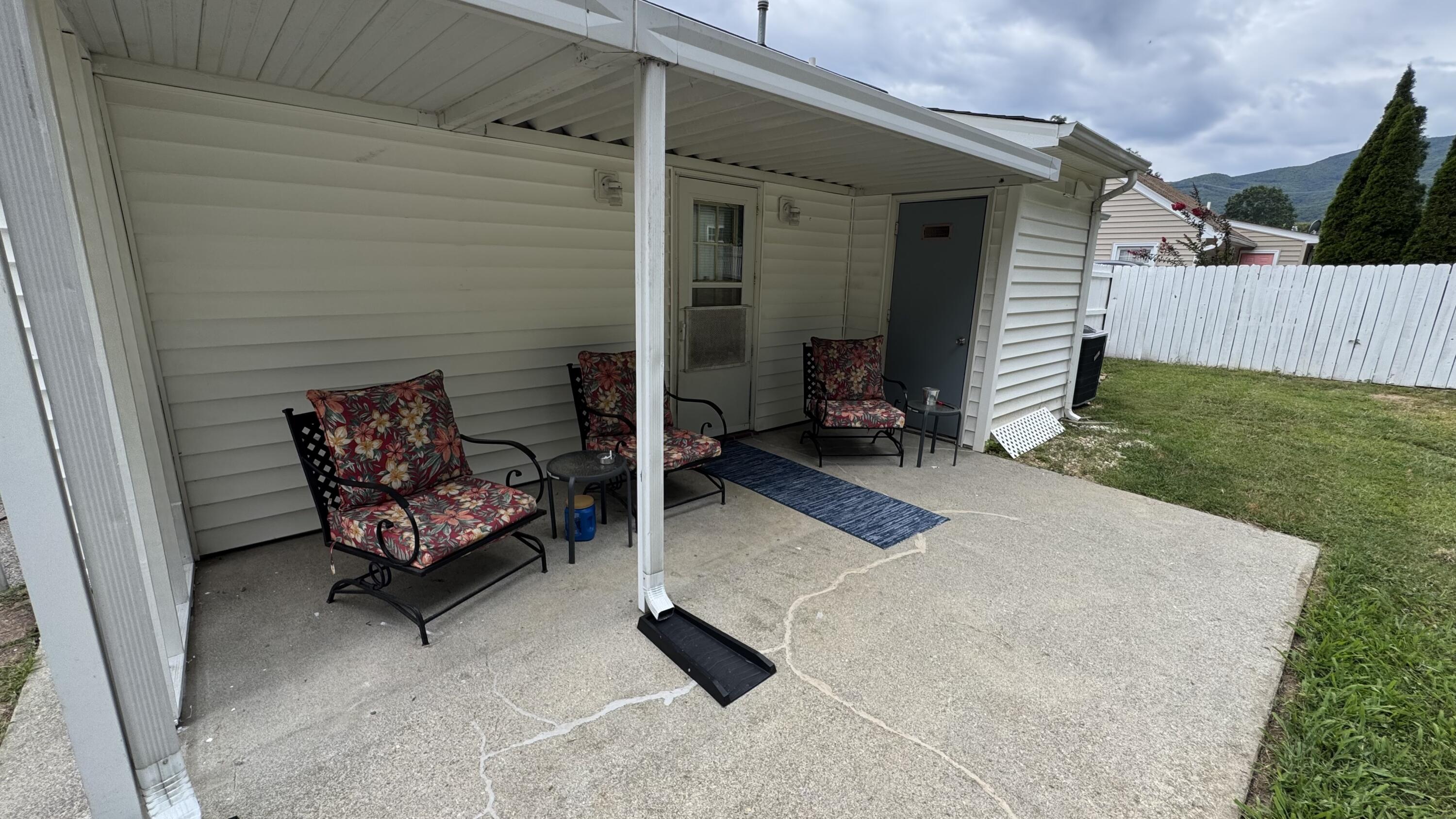 2917 Elderwood Road Salem, VA 24153 - Photo 20 of 24 a backyard of a house with wooden floor barbeque oven and yard