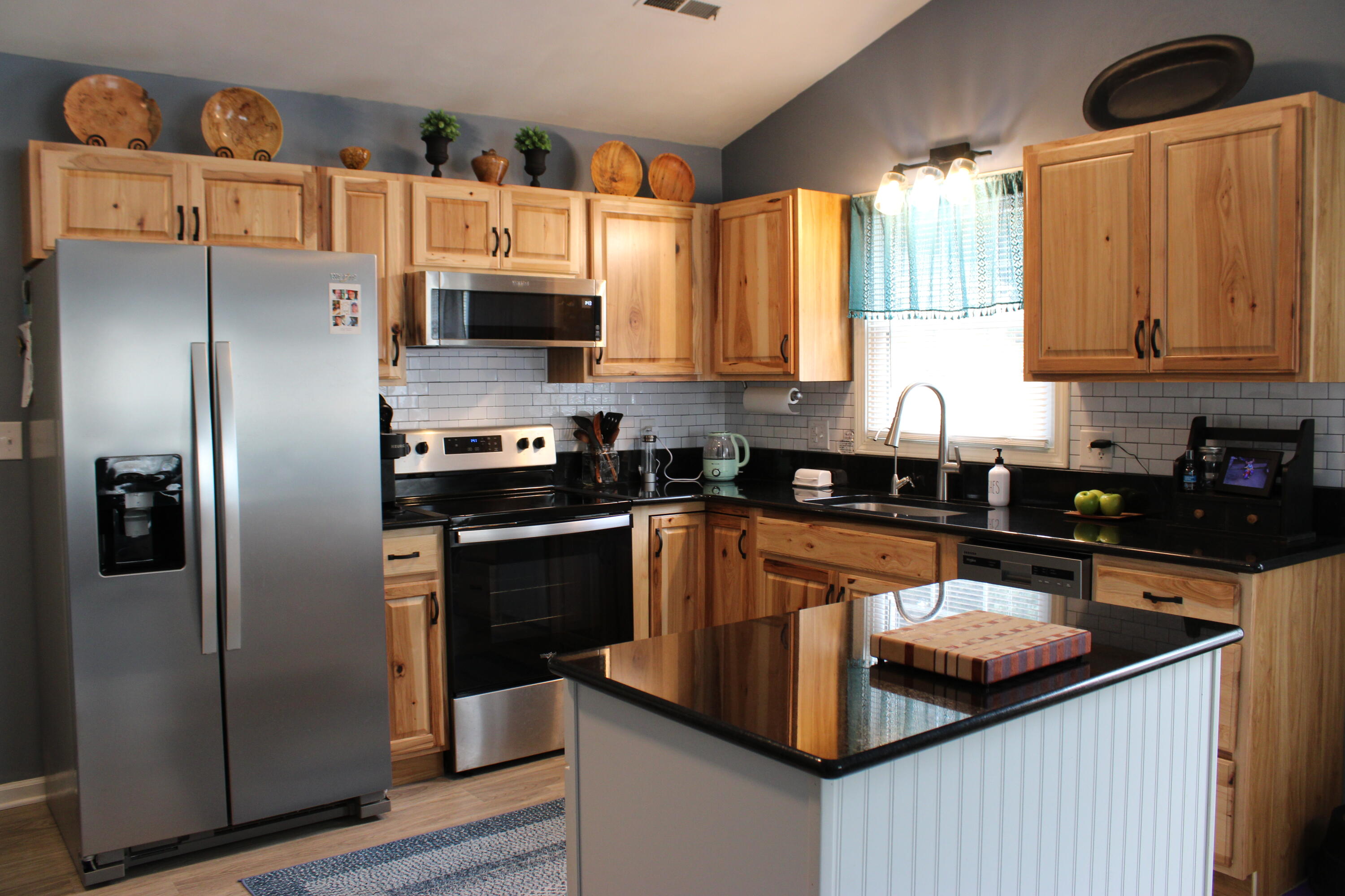 2917 Elderwood Road Salem, VA 24153 - Photo 4 of 24 a kitchen with stainless steel appliances granite countertop a refrigerator a sink a stove and cabinets