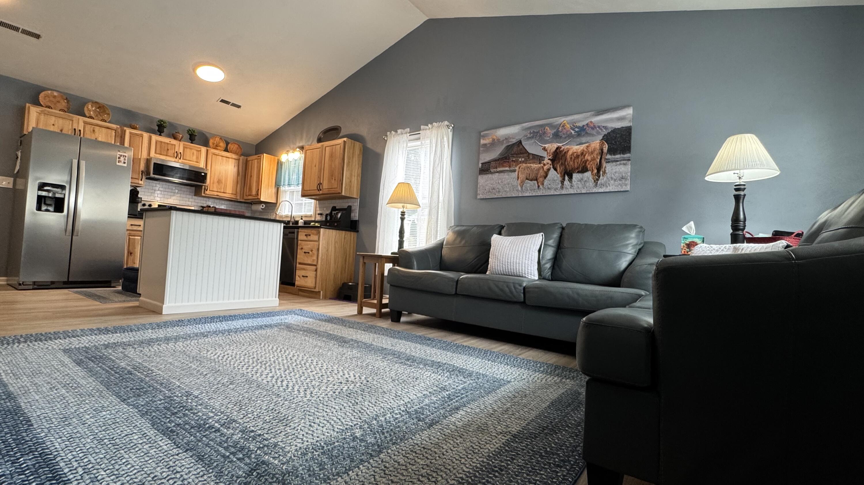 2917 Elderwood Road Salem, VA 24153 - Photo 9 of 24 a living room with a couch and a counter top space