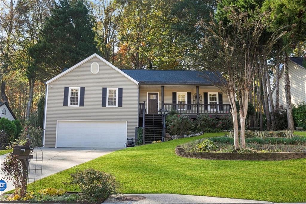 4218 Harris Ridge Court Roswell, GA 30076 - Photo 1 of 1 a front view of a house with a yard