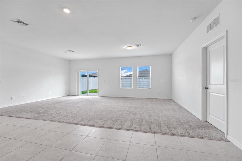 5875 Herder Road St. Cloud, FL 34771 - Photo 11 of 42 a view of an empty room with a window