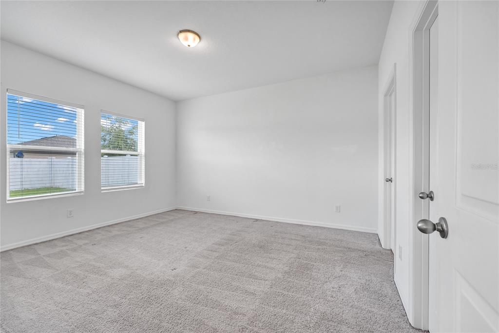5875 Herder Road St. Cloud, FL 34771 - Photo 13 of 42 an empty room with windows
