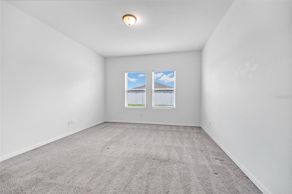 5875 Herder Road St. Cloud, FL 34771 - Photo 14 of 42 an empty room with windows