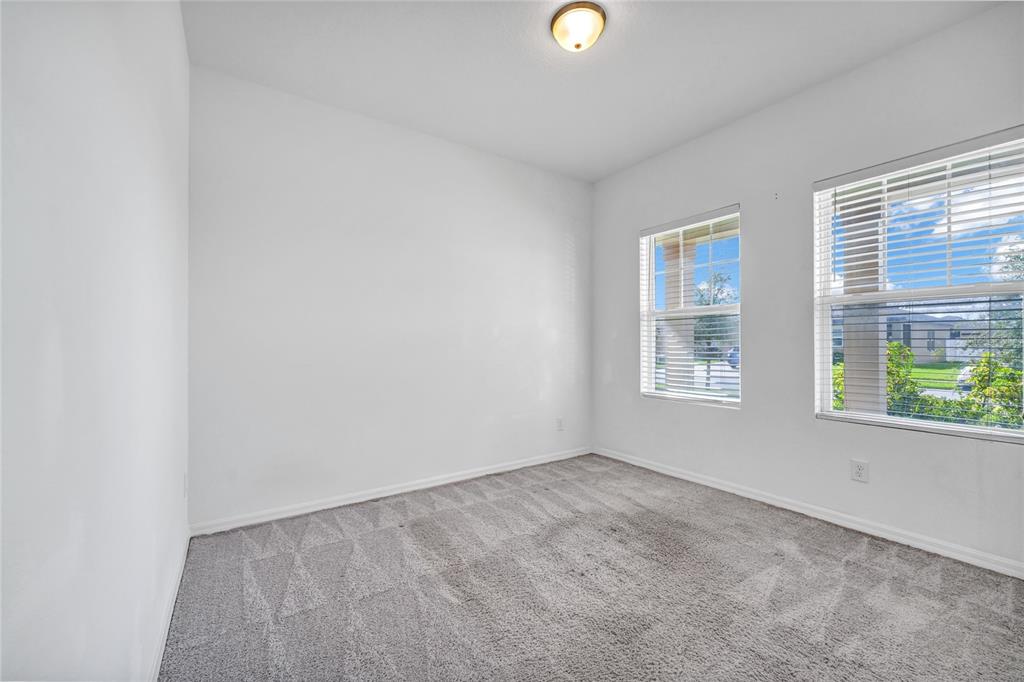 5875 Herder Road St. Cloud, FL 34771 - Photo 18 of 42 an empty room with windows