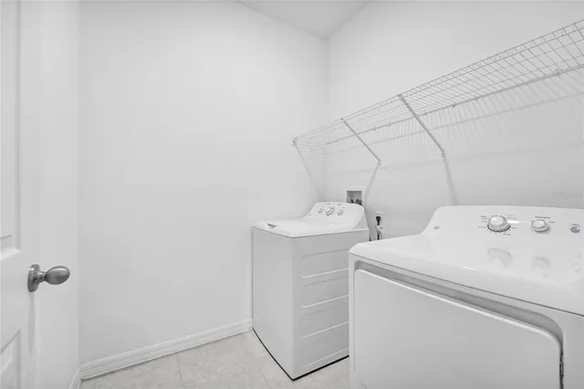 a utility room with dryer and washer