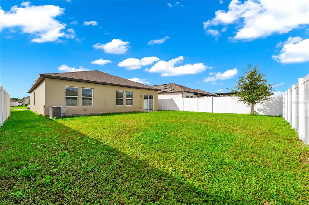 5875 Herder Road St. Cloud, FL 34771 - Photo 25 of 42 a view of a house with a backyard