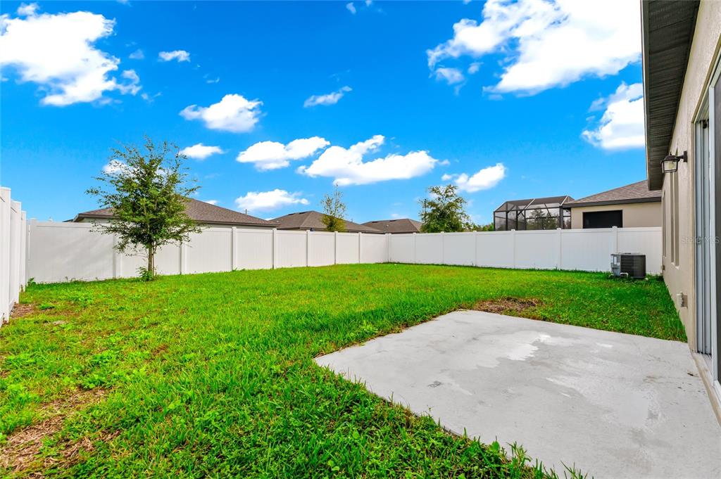 5875 Herder Road St. Cloud, FL 34771 - Photo 26 of 42 a view of a yard with palm trees