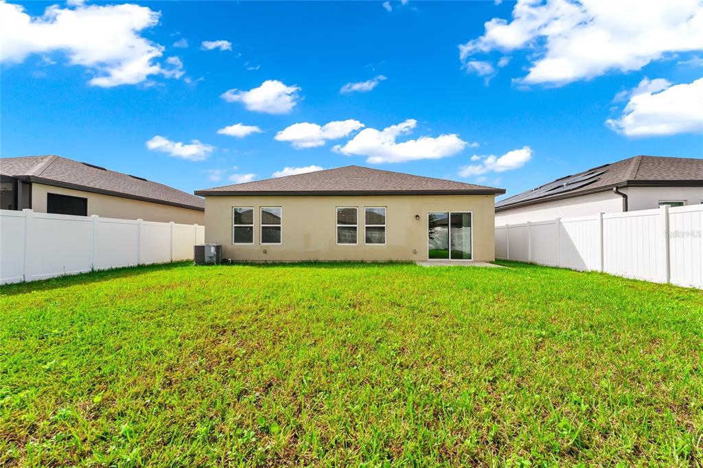 5875 Herder Road St. Cloud, FL 34771 - Photo 28 of 42 a view of a backyard with plants and a backyard