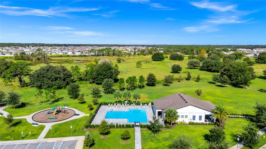 5875 Herder Road St. Cloud, FL 34771 - Photo 36 of 42 an aerial view of residential houses with outdoor space and trees