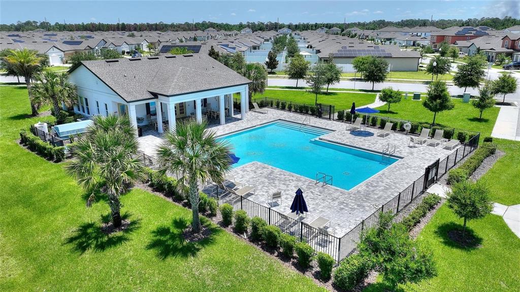 5875 Herder Road St. Cloud, FL 34771 - Photo 38 of 42 an aerial view of a house with swimming pool big yard and large tree
