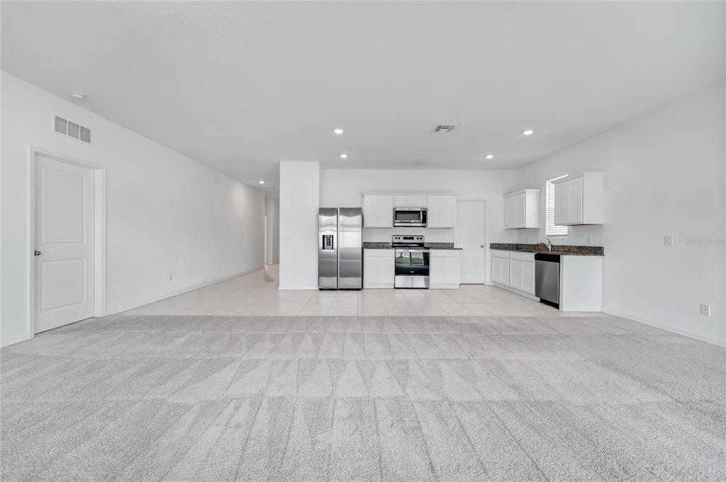 5875 Herder Road St. Cloud, FL 34771 - Photo 4 of 42 a view of kitchen with refrigerator sink and stove