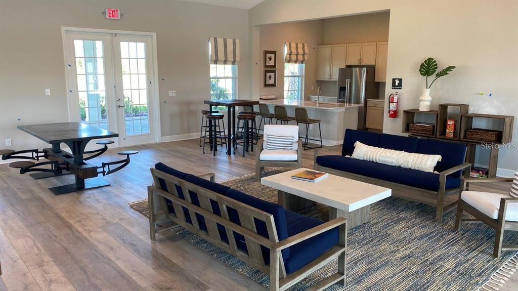 5875 Herder Road St. Cloud, FL 34771 - Photo 42 of 42 a living room with furniture and wooden floor