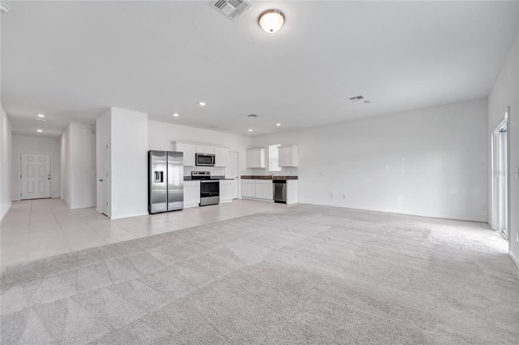 5875 Herder Road St. Cloud, FL 34771 - Photo 5 of 42 a view of kitchen and refrigerator