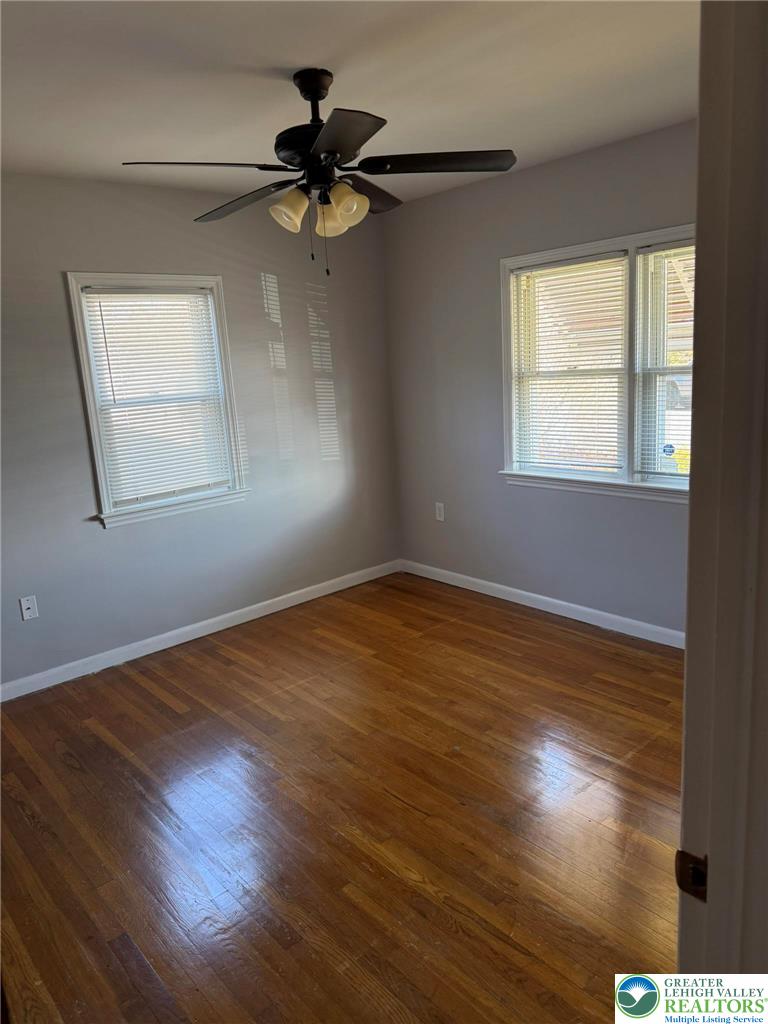 2229 Rodgers Street Bethlehem, PA 18017 - Photo 3 of 17 a view of an empty room with wooden floor and a window
