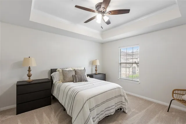 a bedroom with a large bed and a window