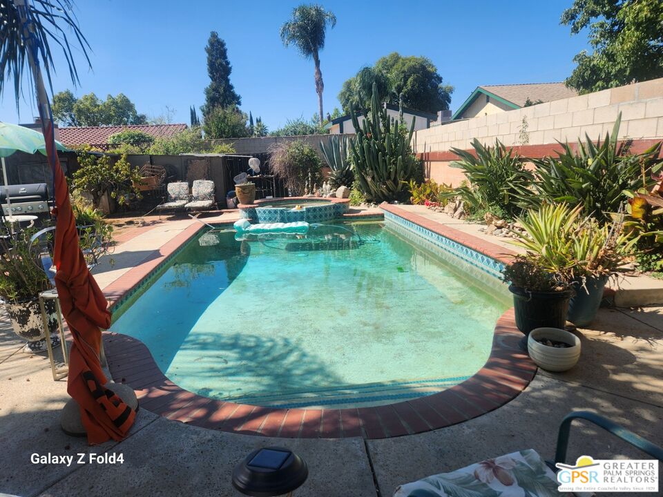 1385 Palm Avenue Beaumont, CA 92223 - Photo 3 of 13 a view of a swimming pool with a patio