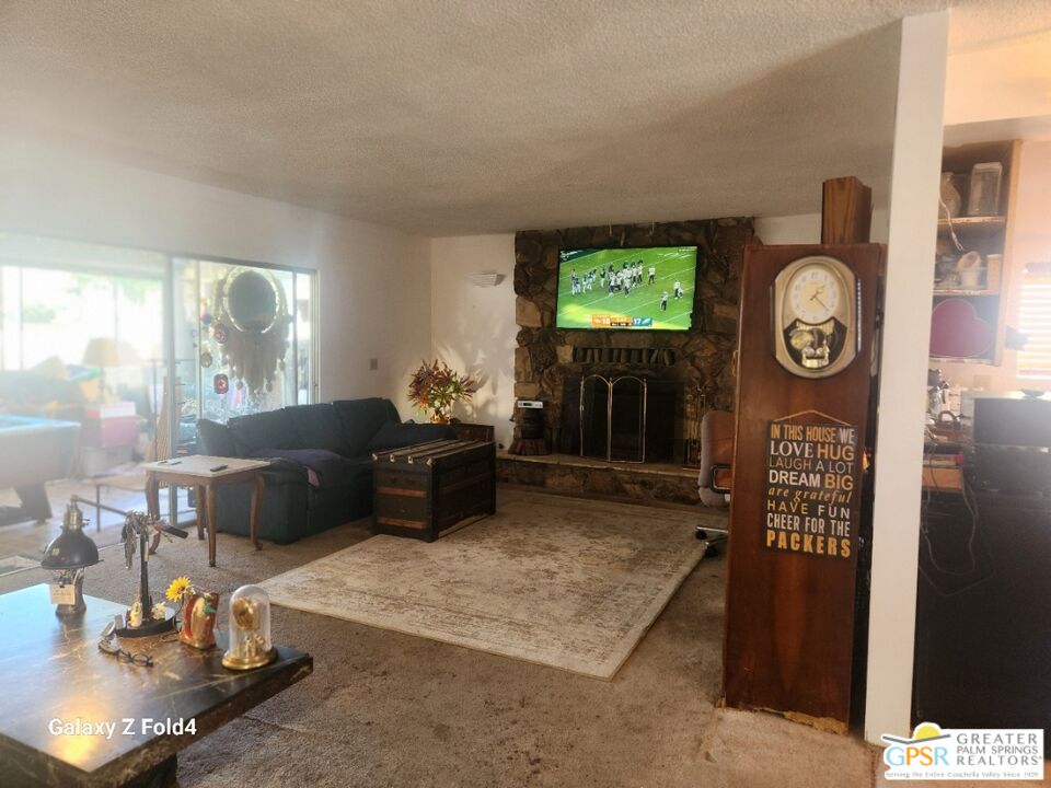 1385 Palm Avenue Beaumont, CA 92223 - Photo 5 of 13 a living room with furniture a rug and a window