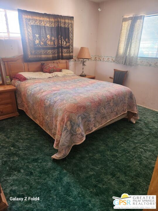 1385 Palm Avenue Beaumont, CA 92223 - Photo 9 of 13 a bedroom with a bed and a dresser