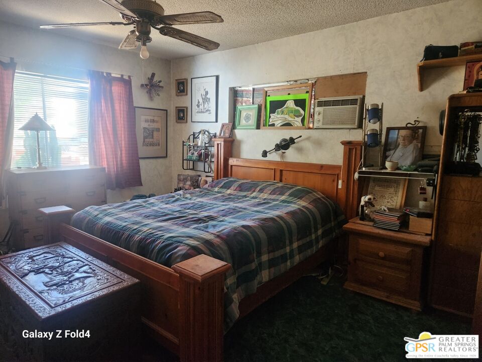 1385 Palm Avenue Beaumont, CA 92223 - Photo 10 of 13 a bedroom with a bed and dresser