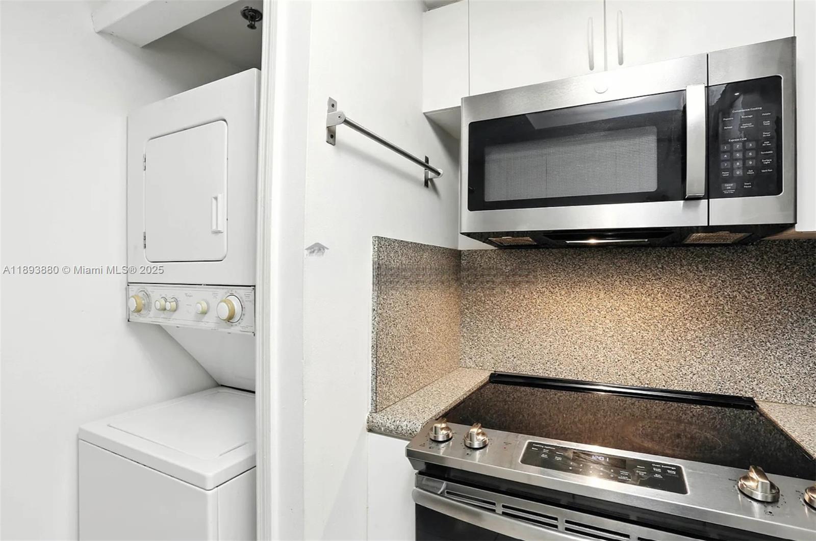 2415 Northwest 16th St Road, Unit 2031 Miami, FL 33125 - Photo 5 of 7 a stove top oven sitting inside of a kitchen
