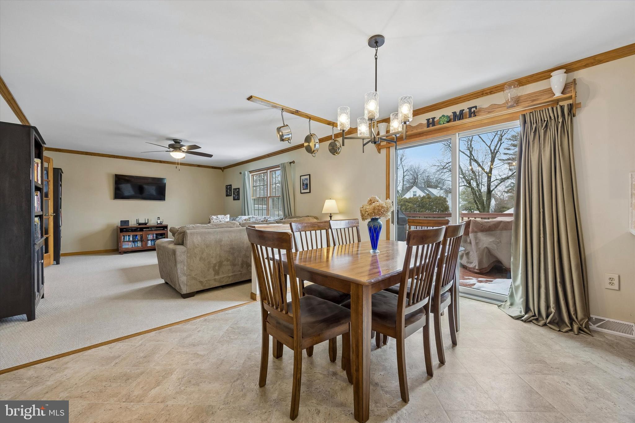 3 Valli Court Hamilton, NJ 08690 - Photo 14 of 48 a view of a dining room and livingroom with furniture wooden floor a chandelier