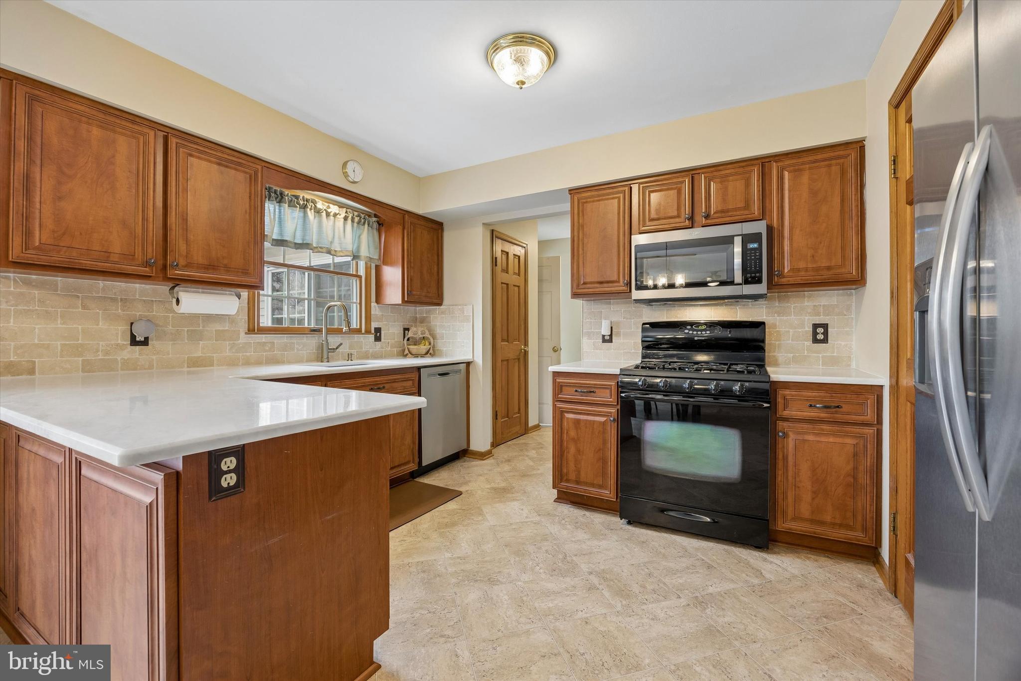 3 Valli Court Hamilton, NJ 08690 - Photo 15 of 48 a kitchen with stainless steel appliances granite countertop a refrigerator stove and sink