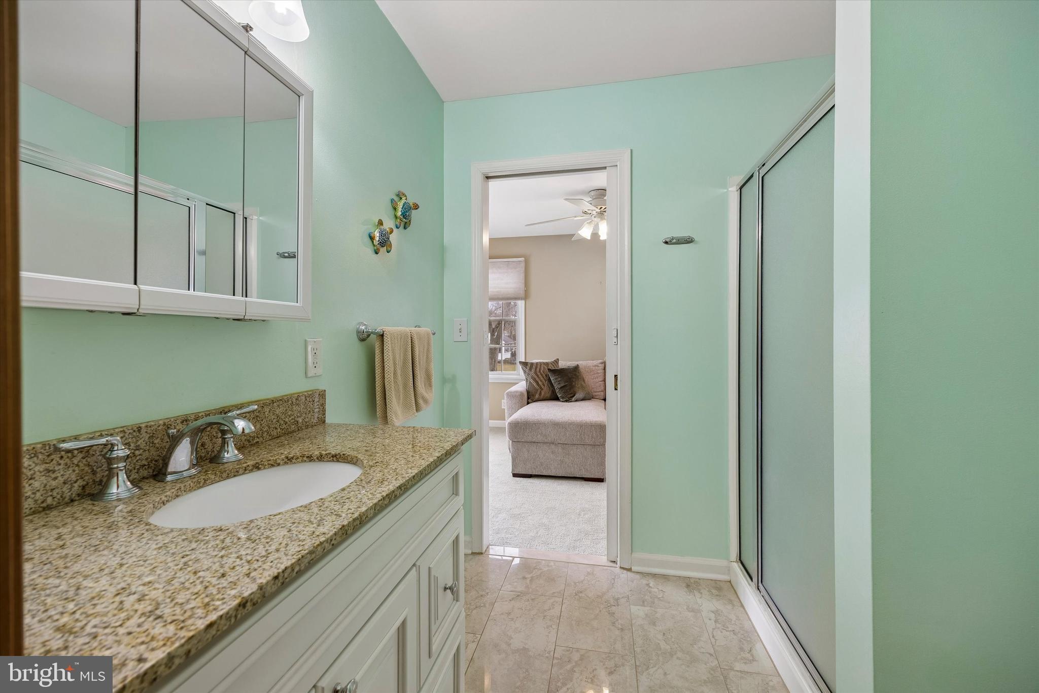 3 Valli Court Hamilton, NJ 08690 - Photo 20 of 48 a en suite bathroom with a granite countertop sink and a mirror
