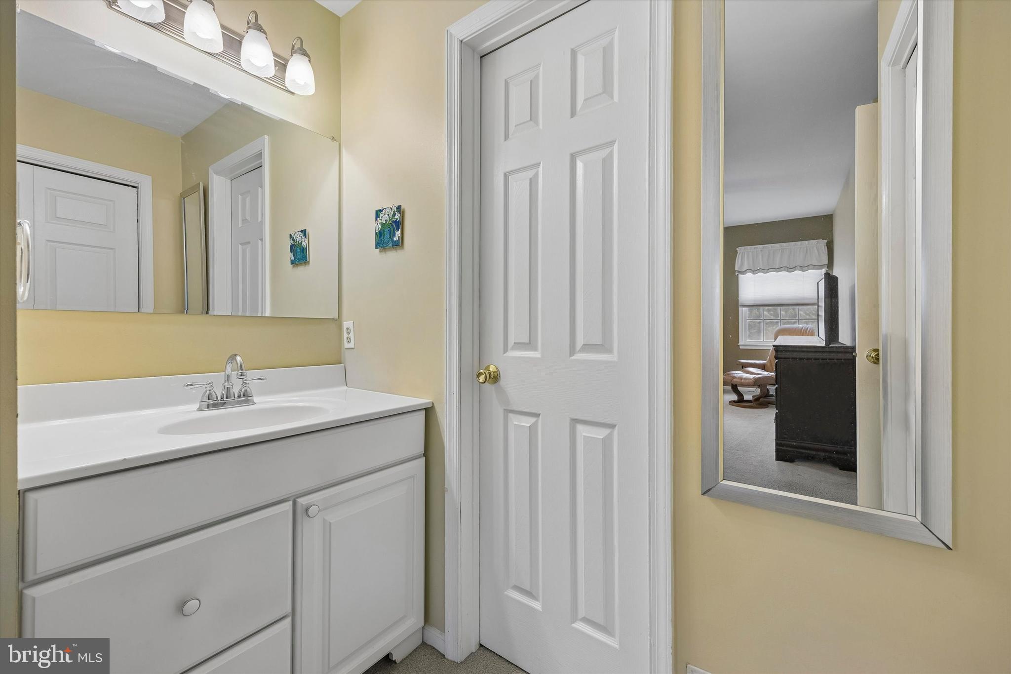 3 Valli Court Hamilton, NJ 08690 - Photo 30 of 48 a bathroom with a granite countertop sink and a mirror