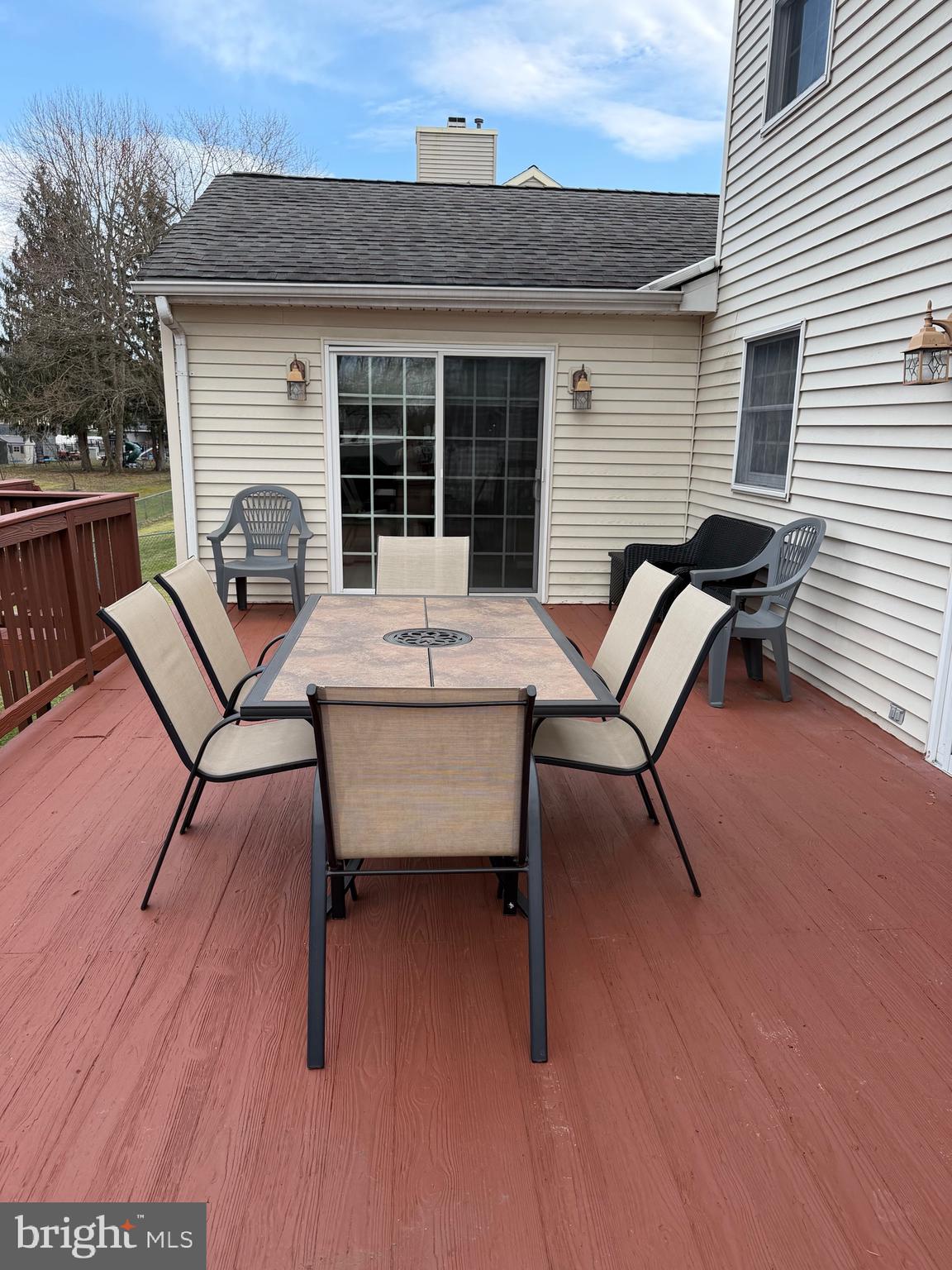 3 Valli Court Hamilton, NJ 08690 - Photo 45 of 48 a backyard of a house with wooden table and chairs