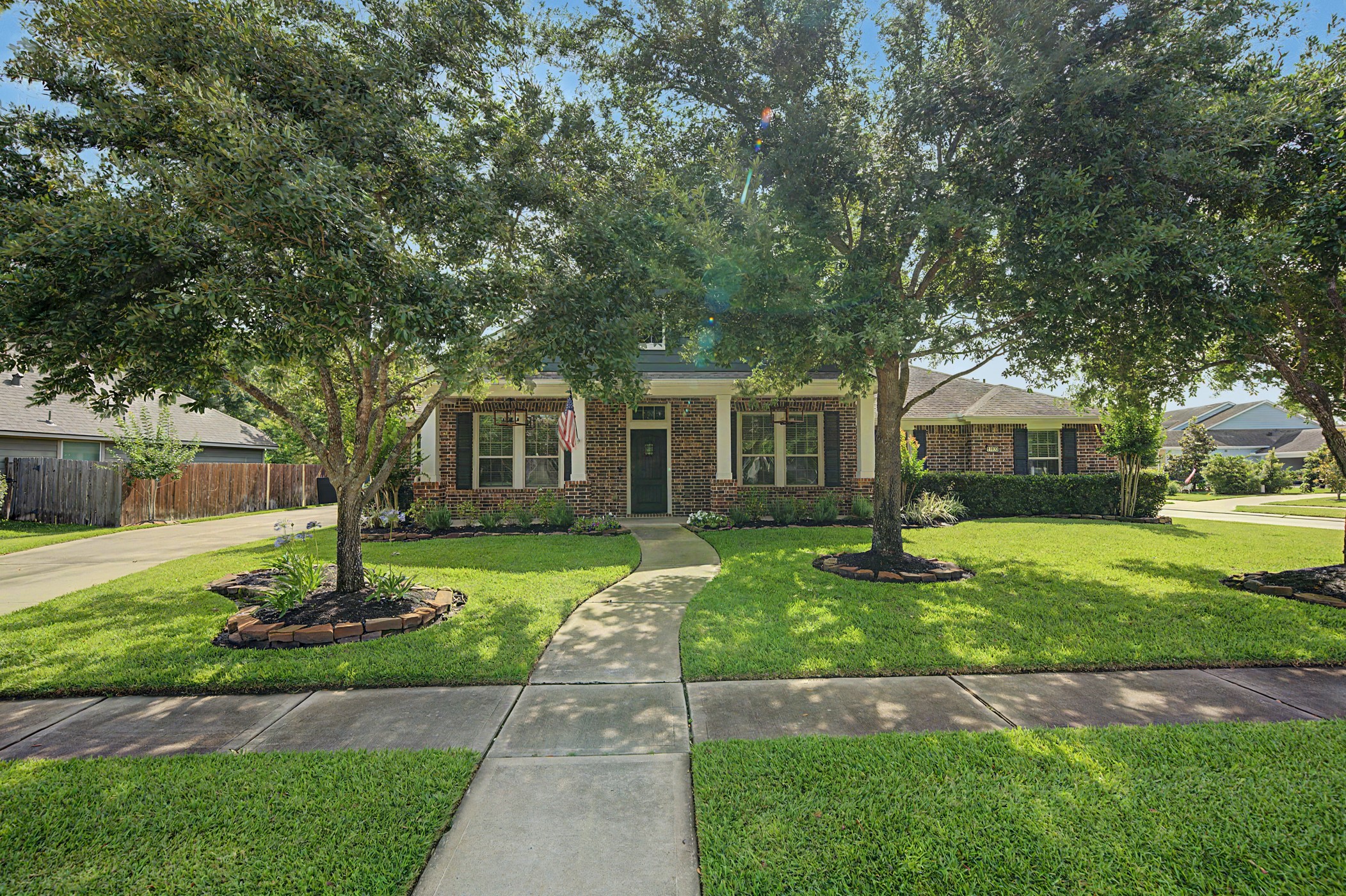 31032 Sunfall Trail Lane Spring, TX 77386 - Photo 39 of 39 a front view of a house with a garden and trees