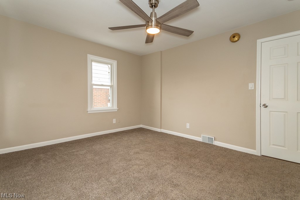 2252 Rockefeller Road Wickliffe, OH 44092 - Photo 12 of 23 Carpeted empty room featuring ceiling fan