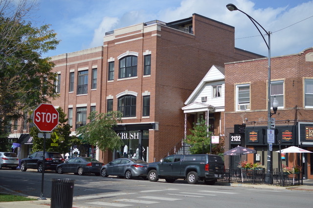 2138 West Roscoe Street Chicago, IL 60618 - Photo 3 of 7 a front view of a building and a street