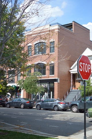 2138 West Roscoe Street Chicago, IL 60618 - Photo 4 of 7 a front view of a building with street