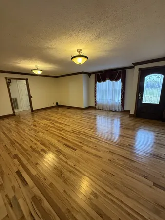 a open kitchen with kitchen island granite countertop wooden cabinets a sink and dishwasher