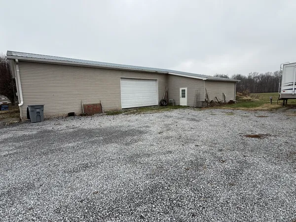 a living room with a couch and a chandelier