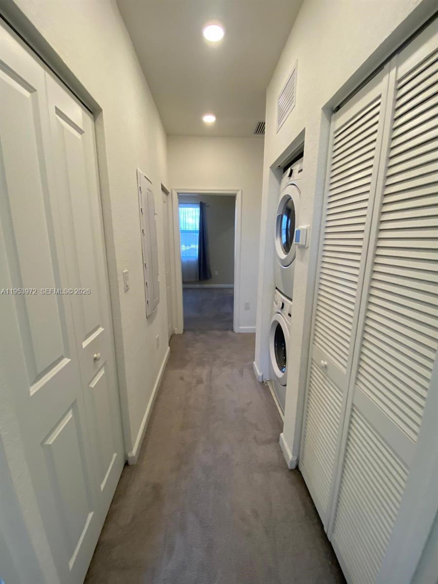 18220 Southwest 148th Road Miami, FL 33187 - Photo 14 of 23 a view of a hallway and washer and dryer