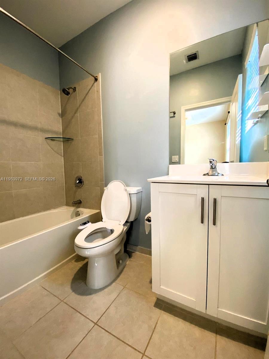 18220 Southwest 148th Road Miami, FL 33187 - Photo 19 of 23 a bathroom with a toilet sink and shower